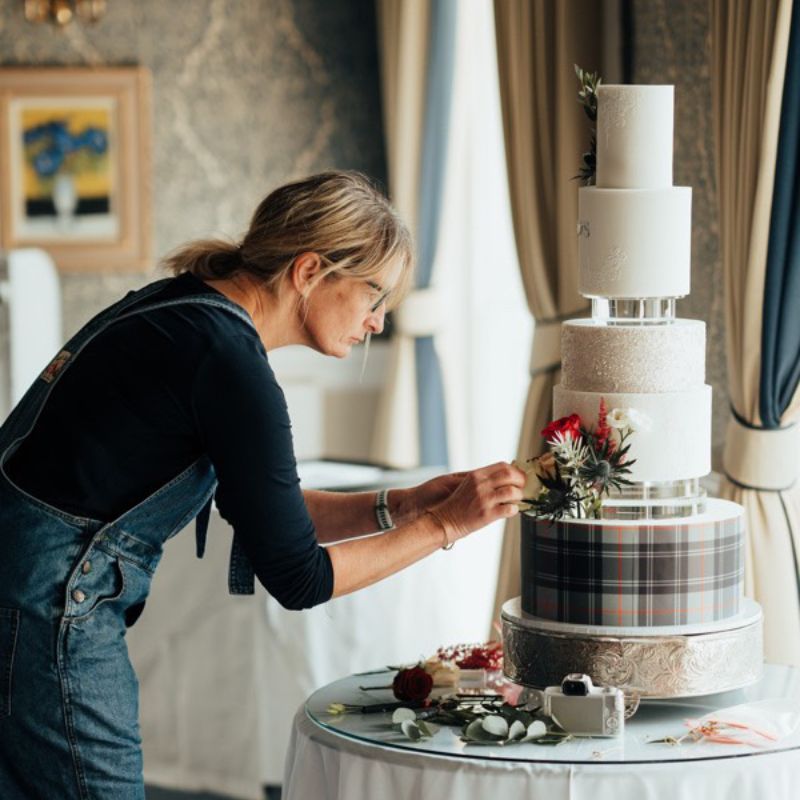 Alison making the finishing touches to a wedding cake