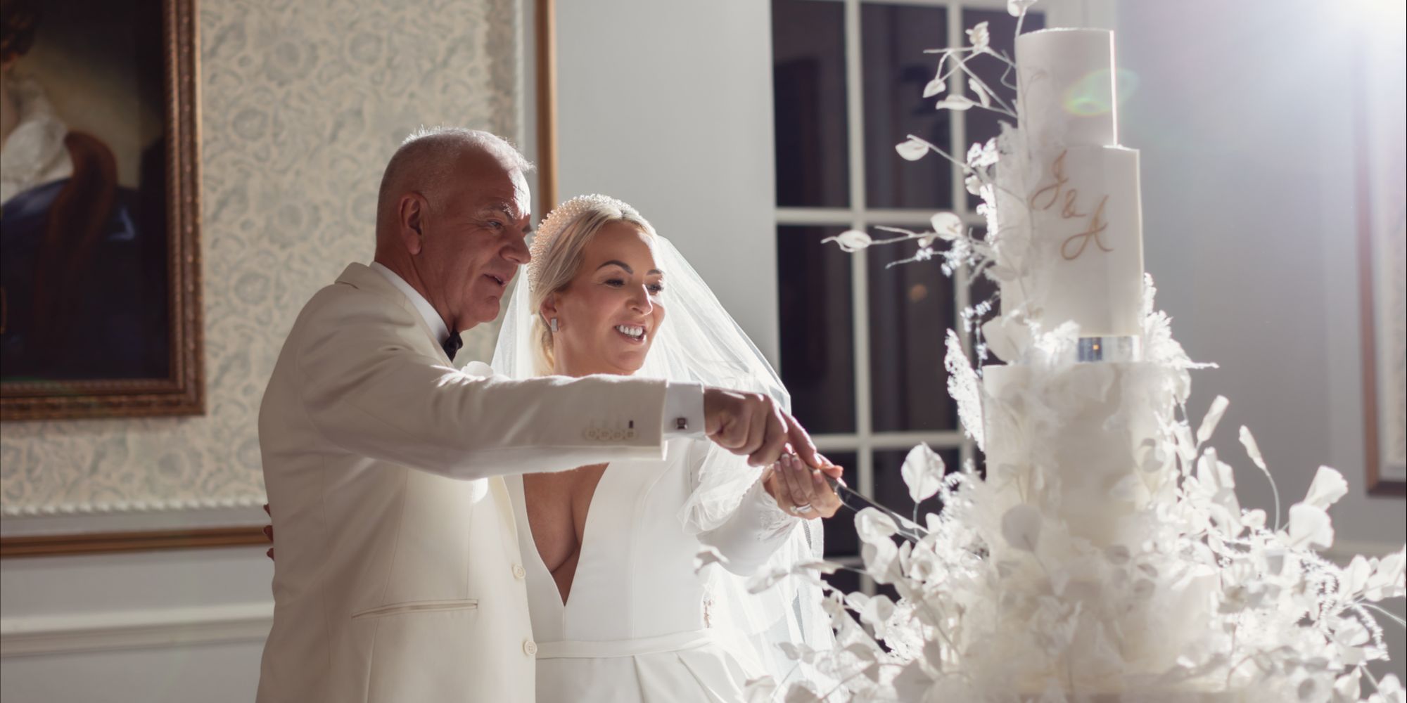 bride and groom cutting their wedding cake