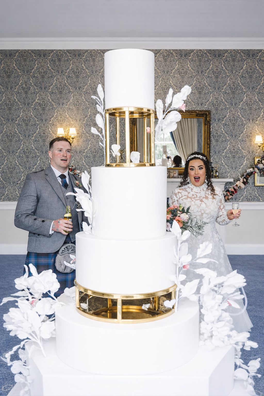 Bride and groom admiring their cake